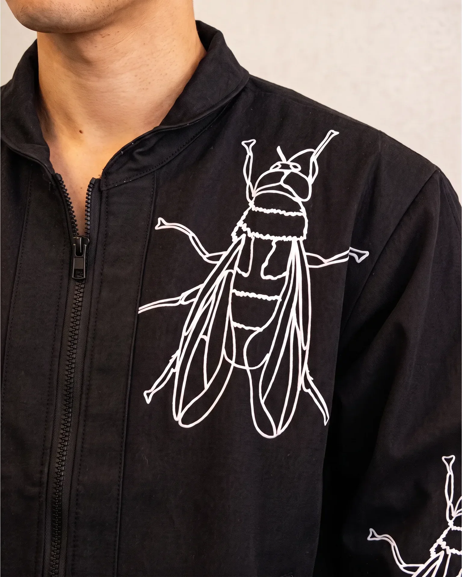 Fly graphic jacket chest artwork detail