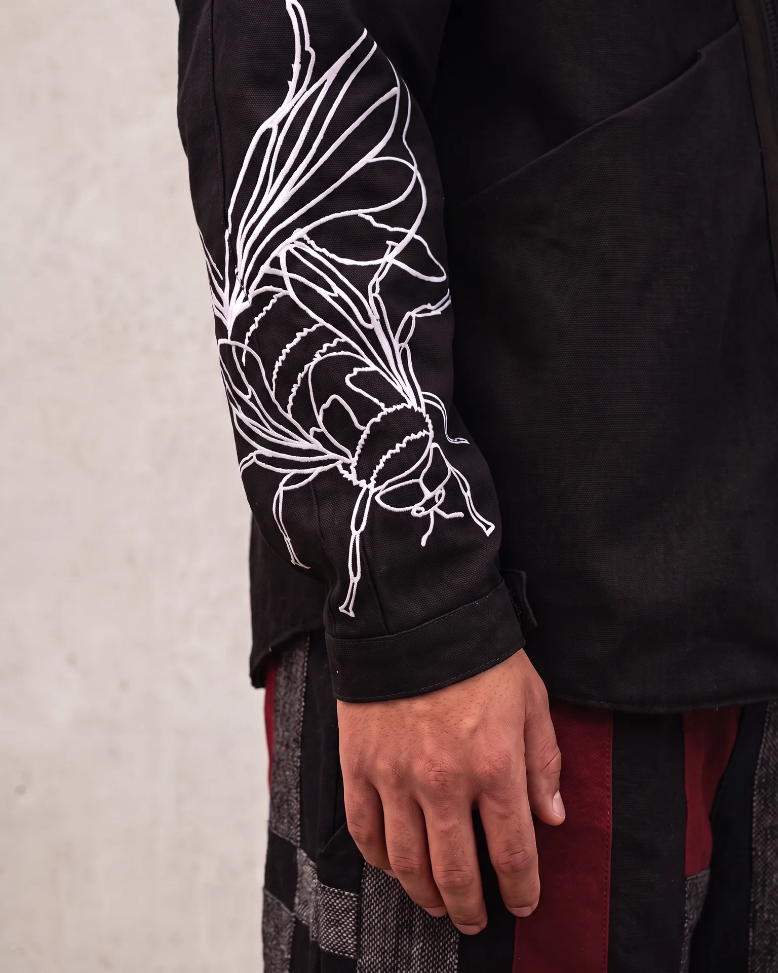 Fly graphic jacket sleeve artwork detail