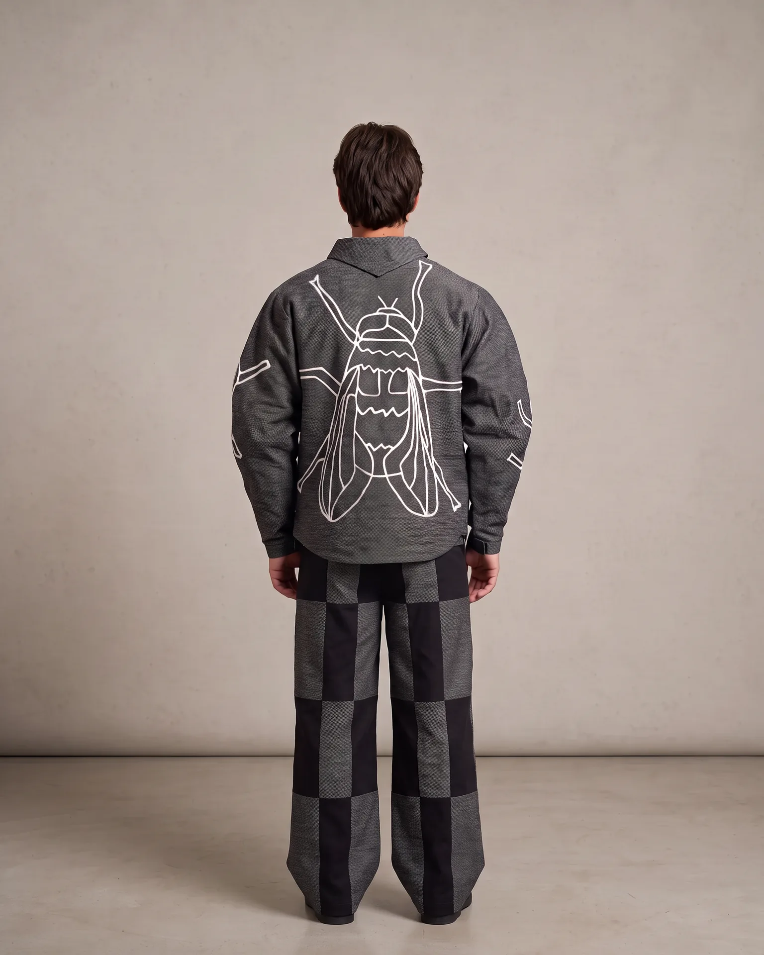 Grey fly jacket worn from the back