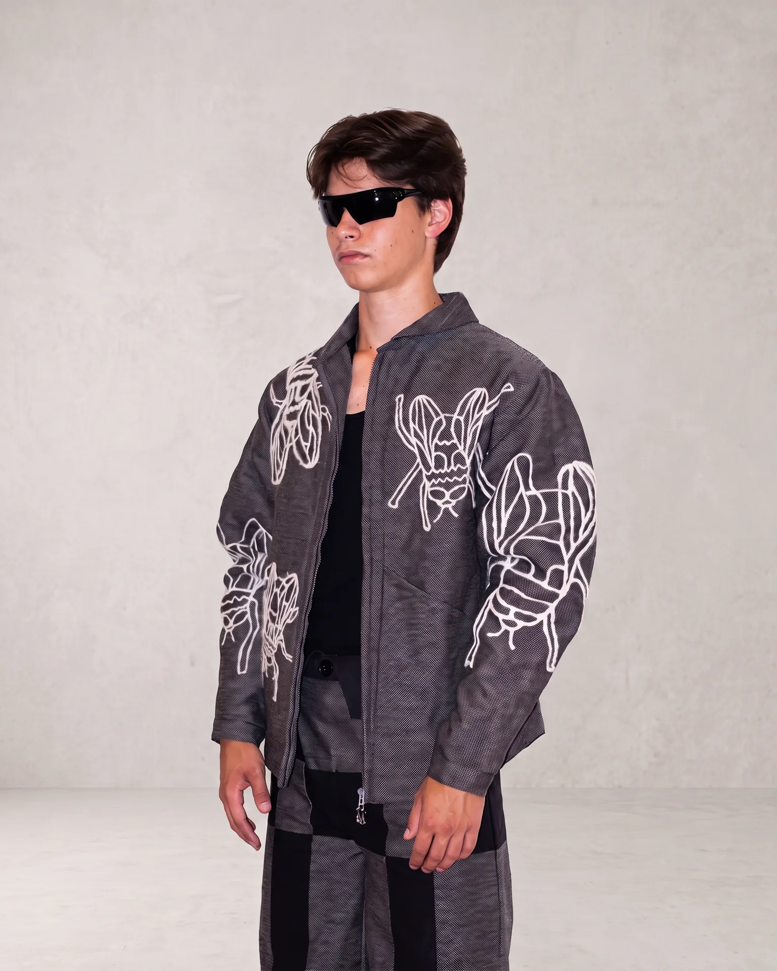 Grey fly jacket worn at an angle